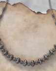 Silver beaded necklace on a textured surface
Silver Jewelry
925 Silver
intricate Design Jewelry