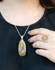 Enormous oval shaped raw citrine stone pendant