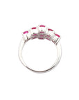 Oval rubies set in prongs in silver ring