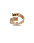 Rose gold bypass ring back profile showing smooth polished shank, open adjustable design, blue sapphire stones visible in upper end channel setting, pink sapphire stones in lower end channel,