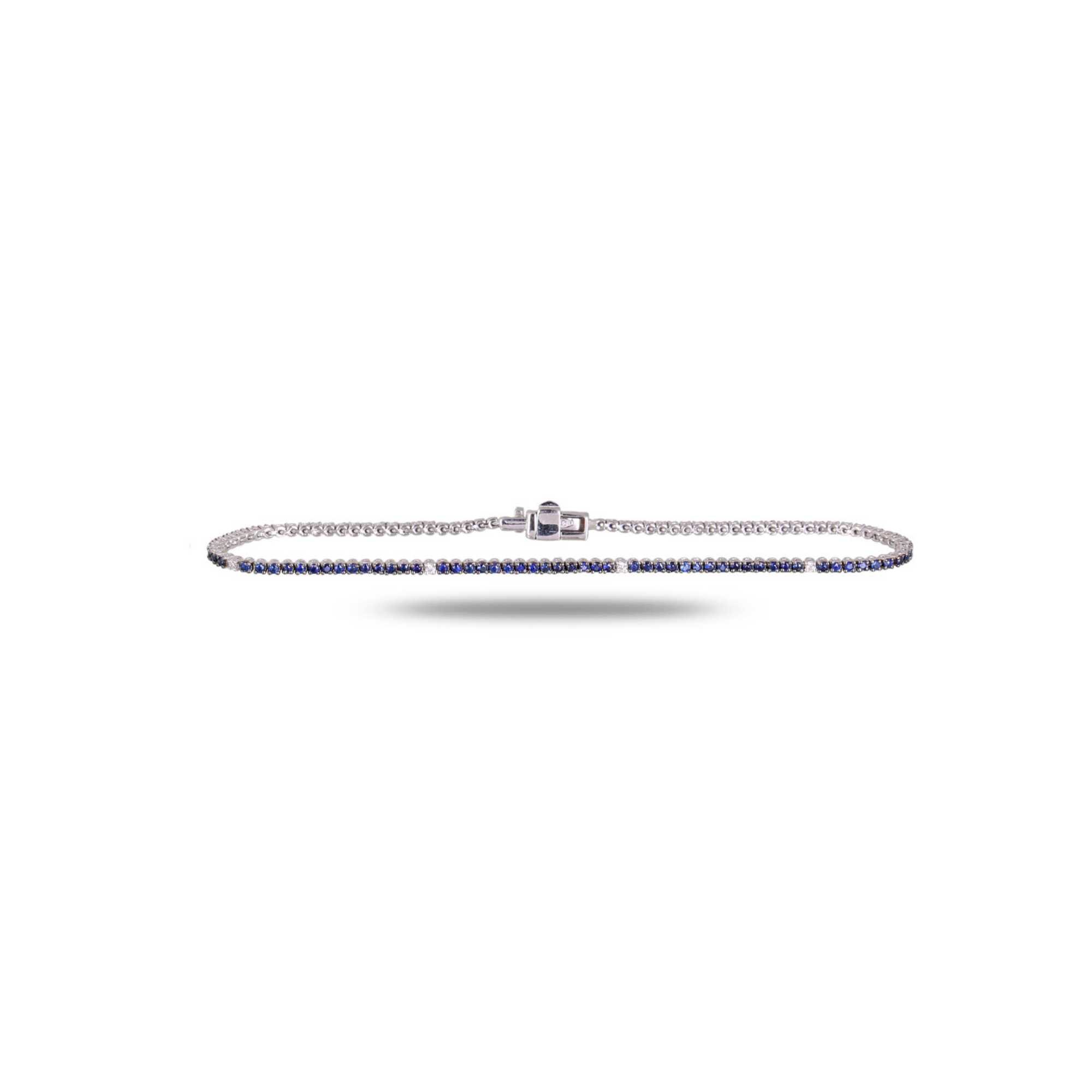 White gold micro pave blue sapphire tennis bracelet with evenly spaced white diamond 